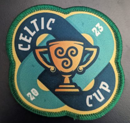 A picture of a fabric patch of the Celtic Cup 2023 logo